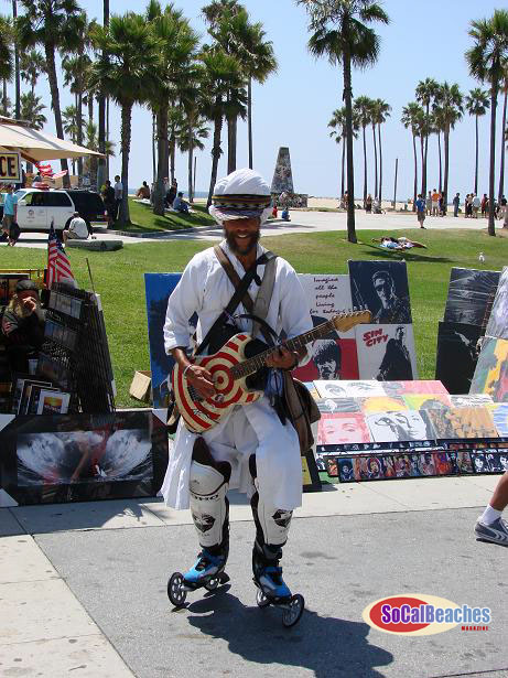  the tattoo'd muscle men lifting weights at Muscle Beach or 